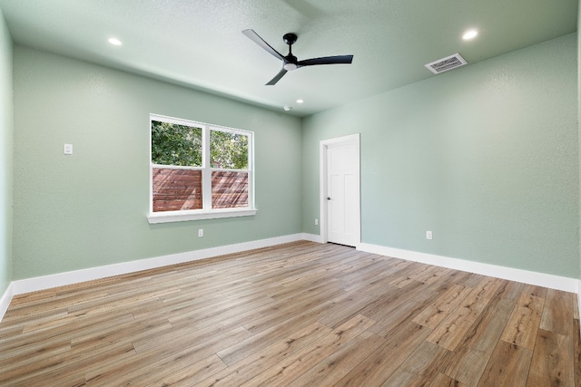 unfurnished room featuring light hardwood / wood-style flooring and ceiling fan