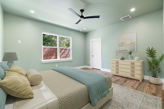 bedroom featuring ceiling fan and light wood-type flooring