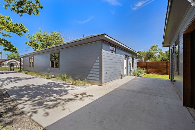 view of side of property with a patio