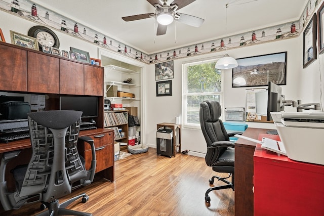 office with ceiling fan and light hardwood / wood-style flooring