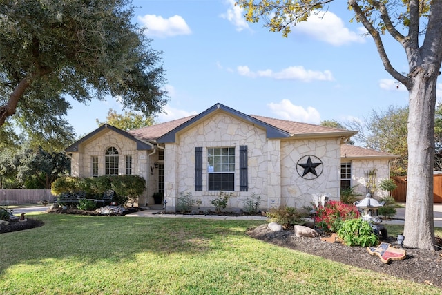 single story home featuring a front yard