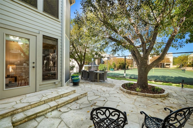 view of patio / terrace featuring tennis court