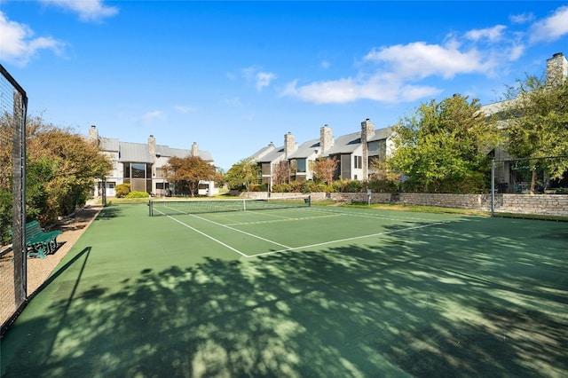 view of tennis court featuring basketball court