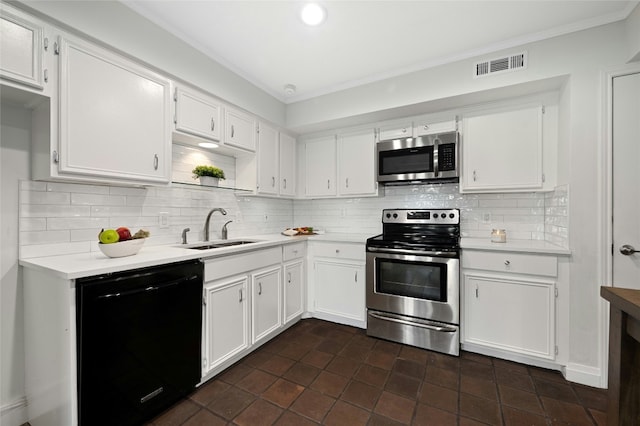 kitchen featuring white cabinets, appliances with stainless steel finishes, tasteful backsplash, sink, and ornamental molding