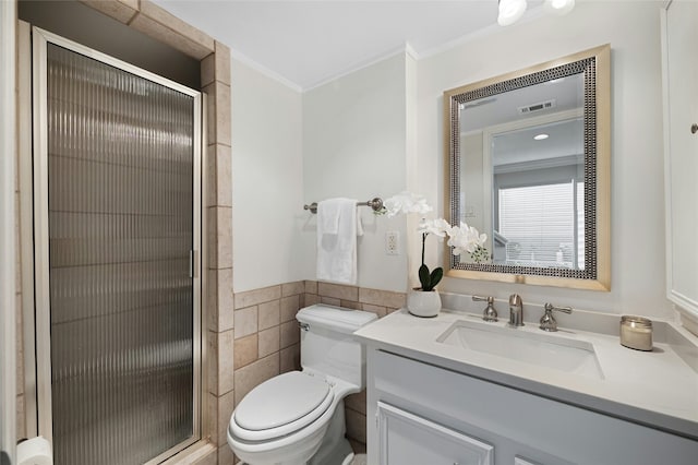 bathroom featuring tile walls, toilet, vanity, and ornamental molding