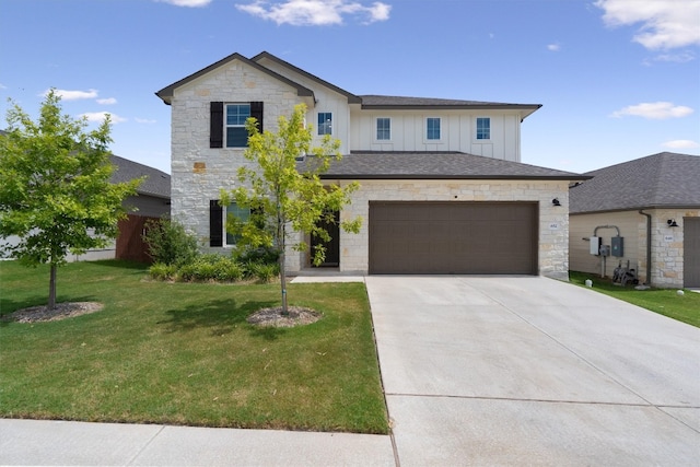 view of front facade with a front yard and a garage