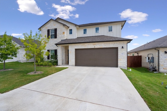 view of front of home with a garage and a front lawn