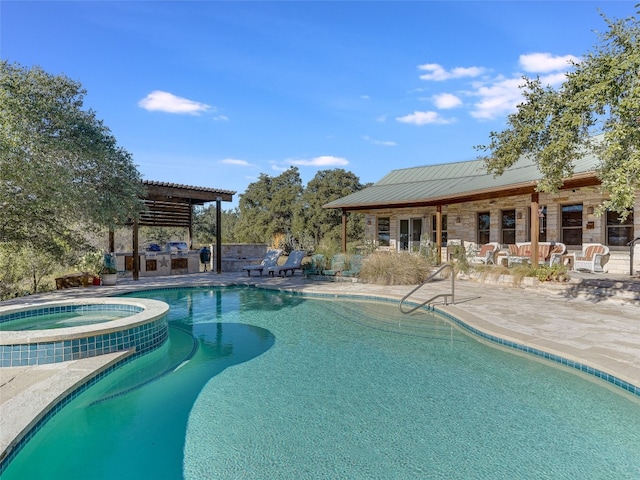1178 Hidden Creek Dr, Dripping Springs, TX 78620 - view of swimming pool with an outdoor kitchen, a patio area, and a pool with connected hot tub
