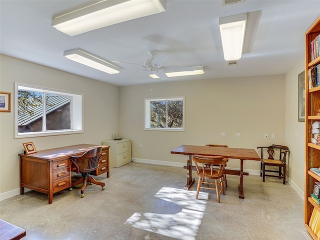 carpeted office with ceiling fan