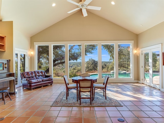 sunroom with ceiling fan, french doors, and lofted ceiling