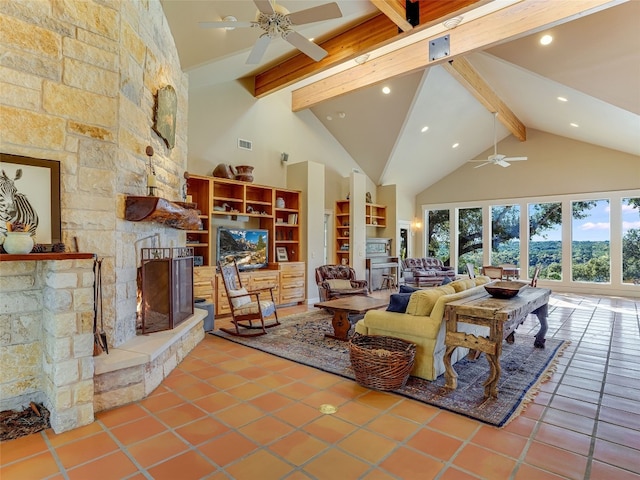 living room featuring beam ceiling, a stone fireplace, tile patterned floors, and high vaulted ceiling