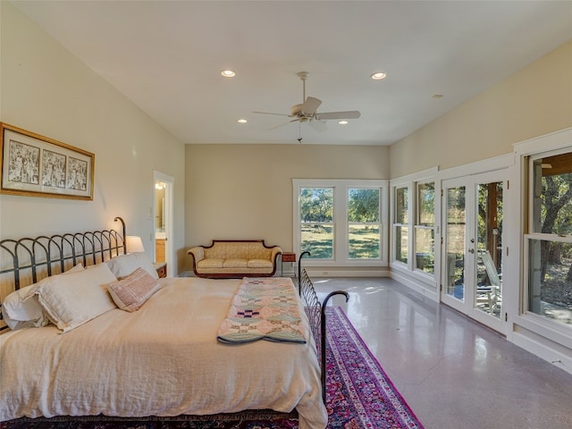 bedroom featuring ceiling fan, access to exterior, concrete flooring, and multiple windows