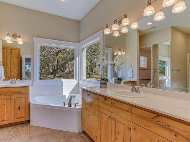 1178 Hidden Creek Dr, Dripping Springs, TX 78620 - full bathroom featuring two vanities, a bath, and tile patterned flooring