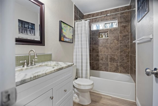 full bathroom featuring toilet, wood-type flooring, vanity, and shower / tub combo with curtain