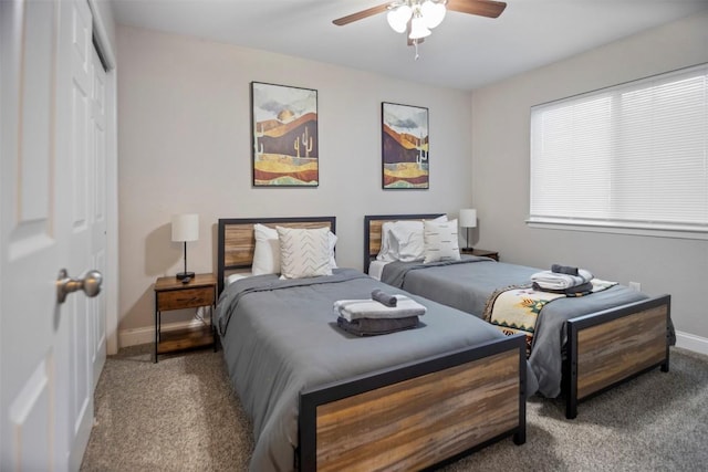 carpeted bedroom featuring ceiling fan and a closet