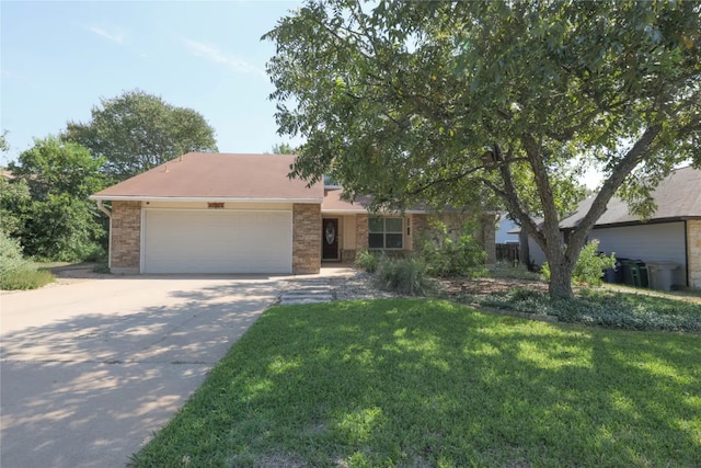 view of front of house featuring a garage and a front yard