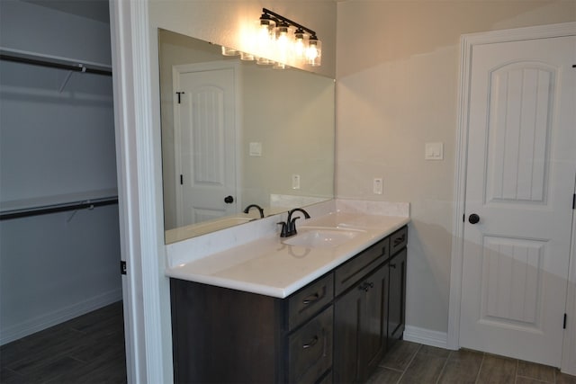 bathroom with vanity and wood-type flooring