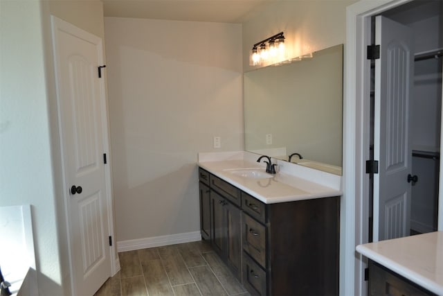 bathroom featuring vanity and wood-type flooring