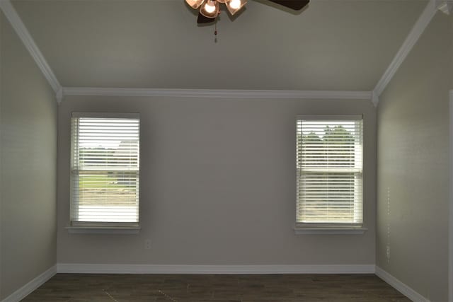 spare room with a wealth of natural light, dark hardwood / wood-style flooring, and ornamental molding