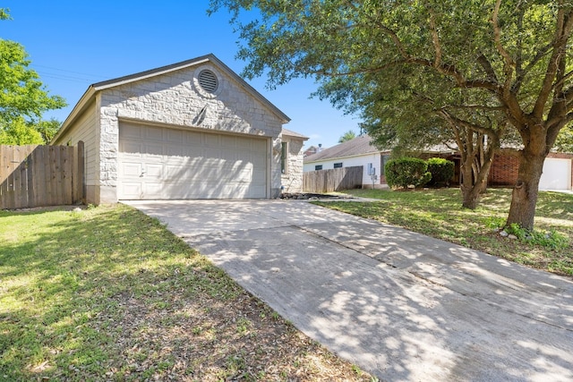 ranch-style house with a garage and a front lawn