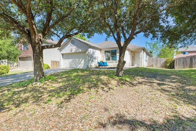 view of front of home with a front yard and a garage