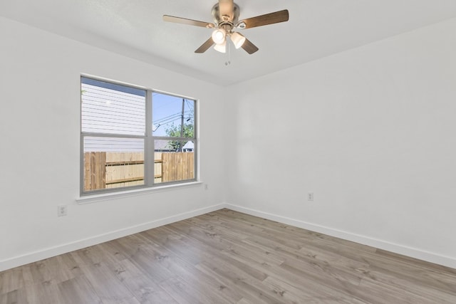 unfurnished room with ceiling fan and light hardwood / wood-style flooring