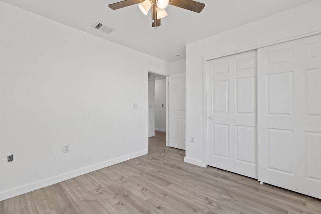 unfurnished bedroom with a closet, ceiling fan, and light hardwood / wood-style flooring