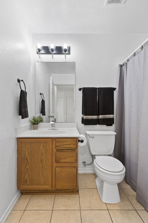 7913 Eudora Ln, Austin, TX 78747 - bathroom with vanity, toilet, tile patterned floors, baseboards, and a shower with curtain