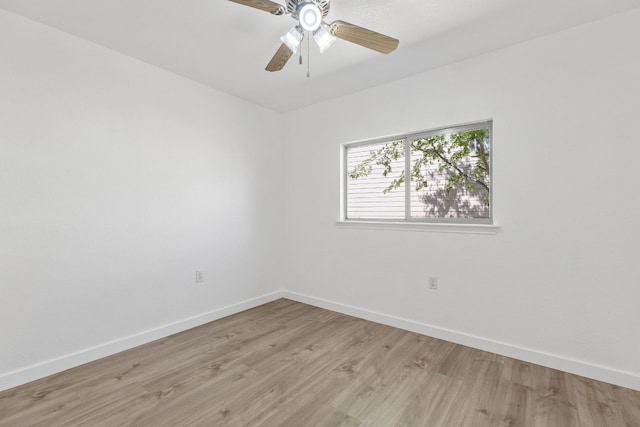 empty room featuring ceiling fan and light wood-type flooring