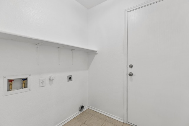 laundry area with electric dryer hookup, hookup for a gas dryer, light tile patterned floors, and hookup for a washing machine