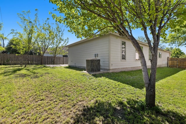 view of yard with central AC