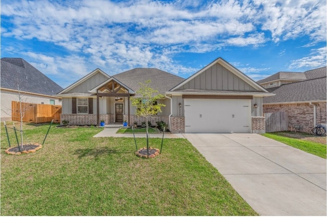 craftsman-style house featuring a garage and a front lawn