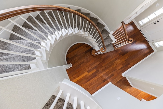 stairs featuring wood-type flooring