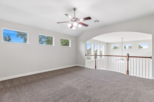 carpeted spare room with ceiling fan