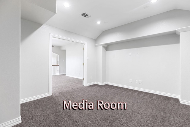 basement featuring dark carpet