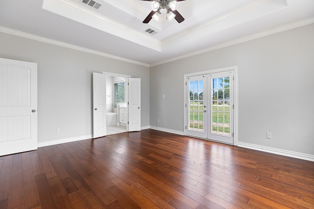 unfurnished room featuring hardwood / wood-style flooring, a tray ceiling, and crown molding