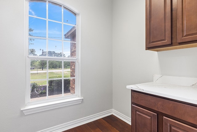 laundry room featuring dark hardwood / wood-style flooring