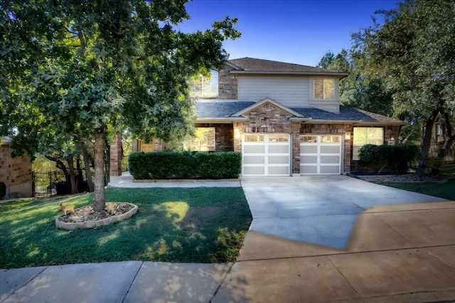 view of front of property with a garage and a front yard