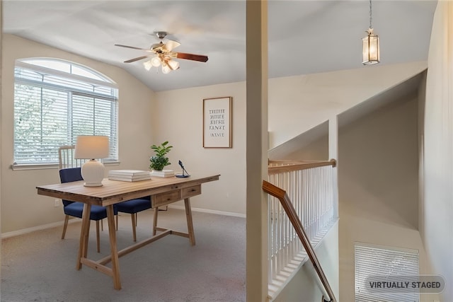 office area featuring lofted ceiling, carpet, baseboards, and ceiling fan