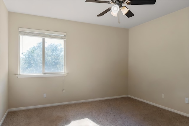 spare room featuring ceiling fan, baseboards, and carpet flooring