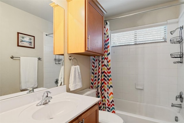 full bath with shower / bath combo, vanity, and toilet