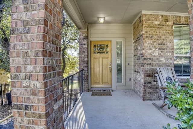 entrance to property with brick siding