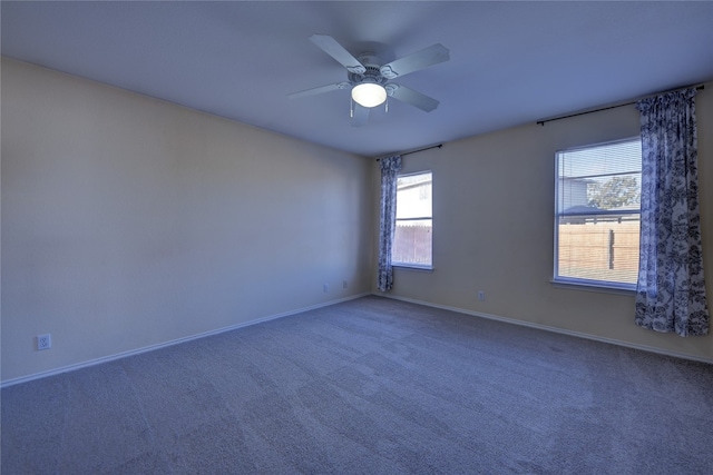 unfurnished room featuring ceiling fan and carpet floors