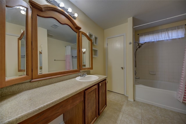 bathroom featuring tile patterned floors, vanity, and shower / tub combo with curtain