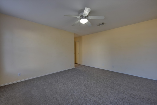 carpeted empty room featuring ceiling fan