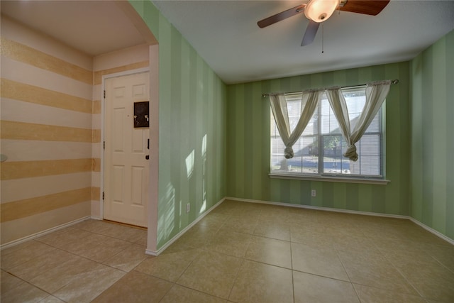 entryway with ceiling fan and light tile patterned floors