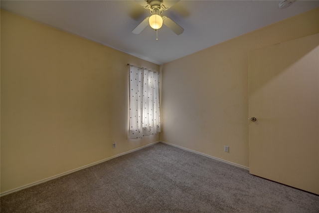 empty room with carpet floors and ceiling fan