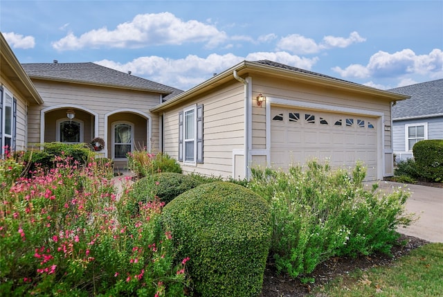 view of side of home with a garage