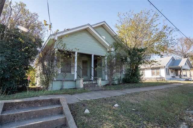 420 E 4th St, Taylor, TX 76574 - view of front of home with covered porch and a front lawn