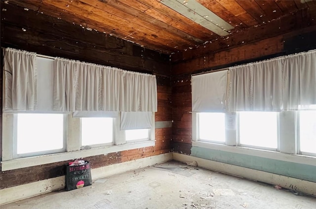 empty room with wood ceiling